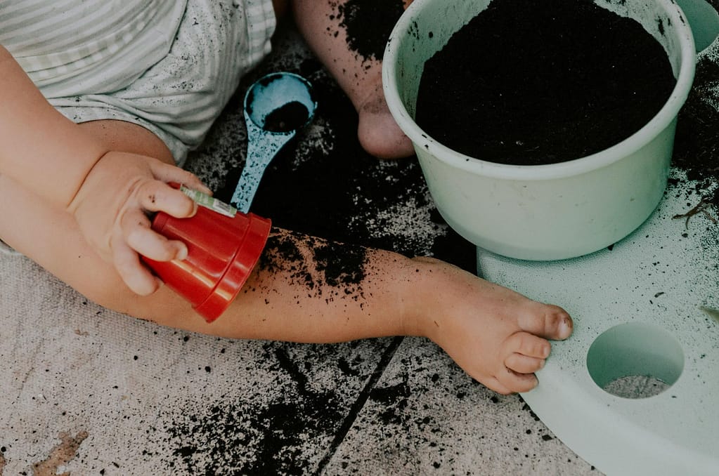 Winter break activities - sometimes you just have to let them do whatever they want, even taking the soil out of your pots.