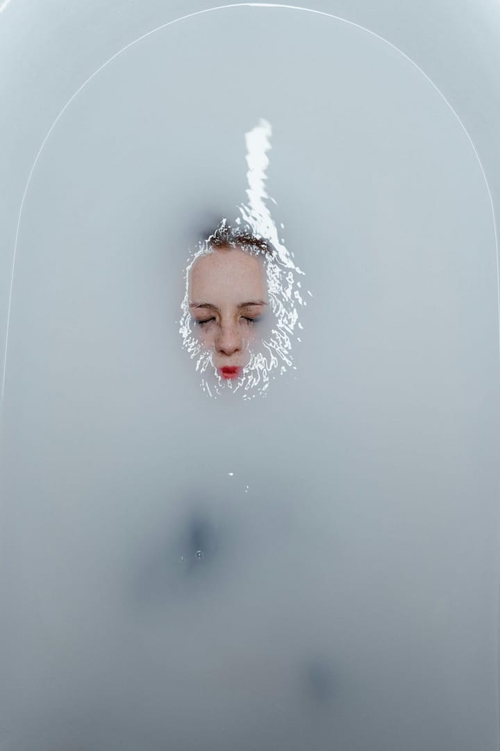 Exhausted mom having a dramatic bath experience