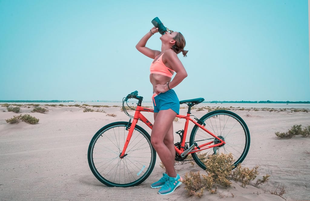 A woman drinking during a beach ride not knowing of the effects of alcohol