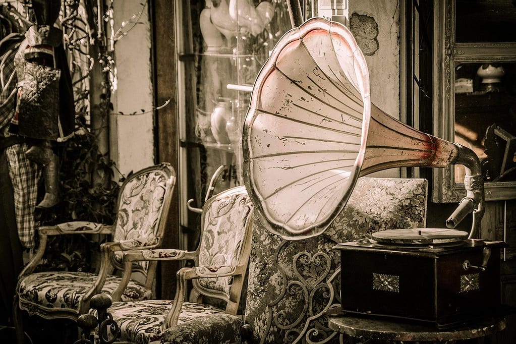 Vintage gramophone with ornate chairs as a symbol of dreaming of my ex